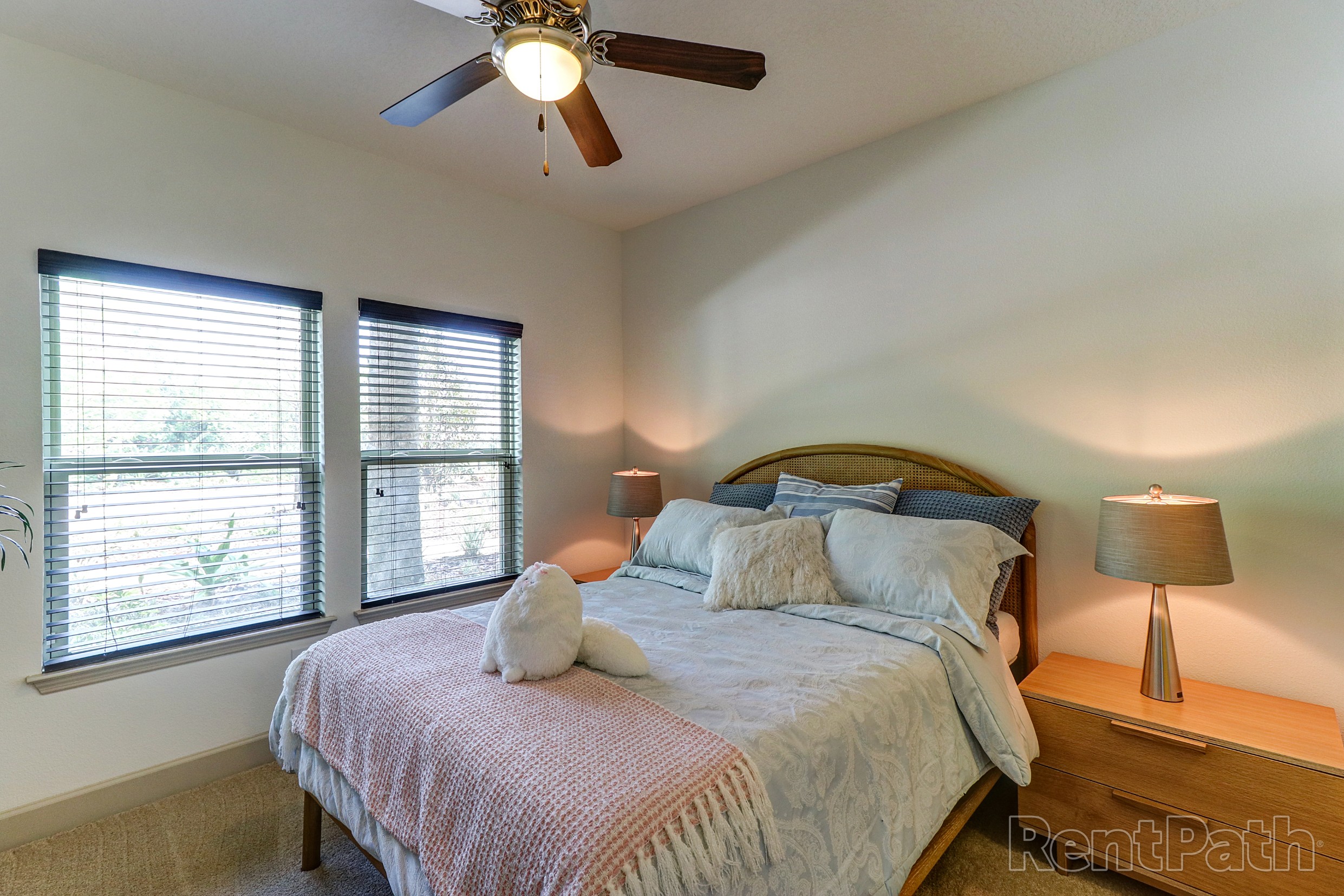 Carpeted model bedroom at Astoria at Celebration