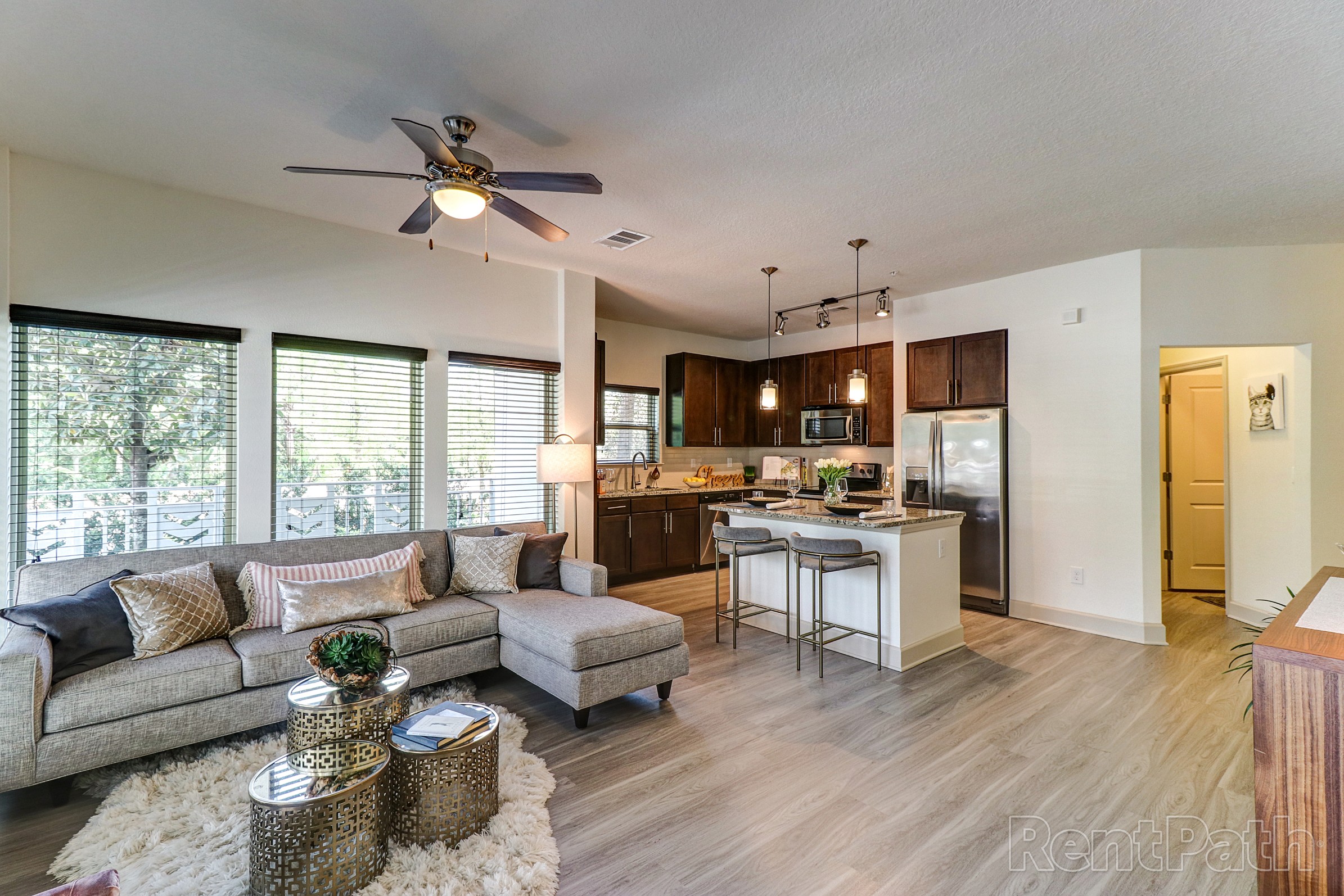 Open model kitchen and living room of an apartment at Astoria at Celebration
