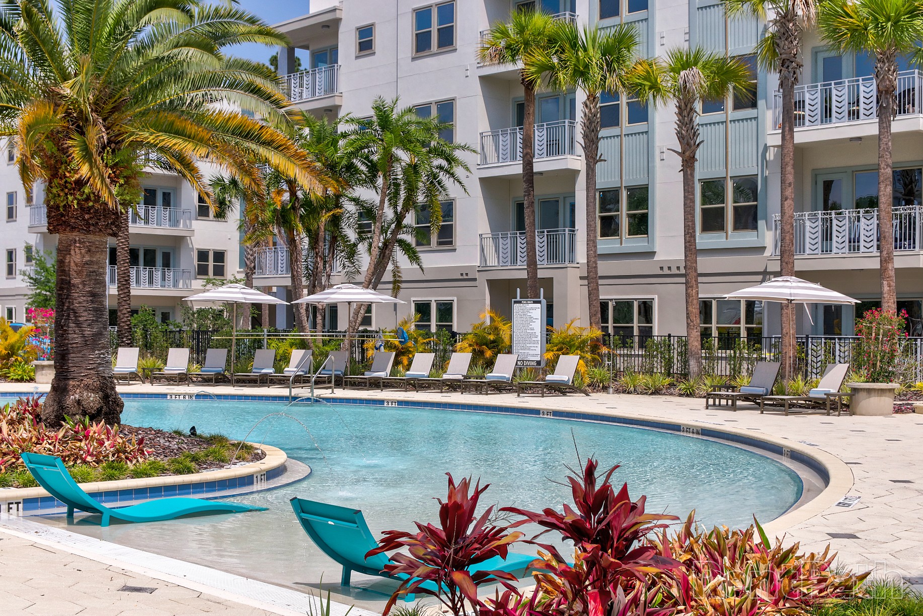 Zero entry resort style pool and lounge chairs